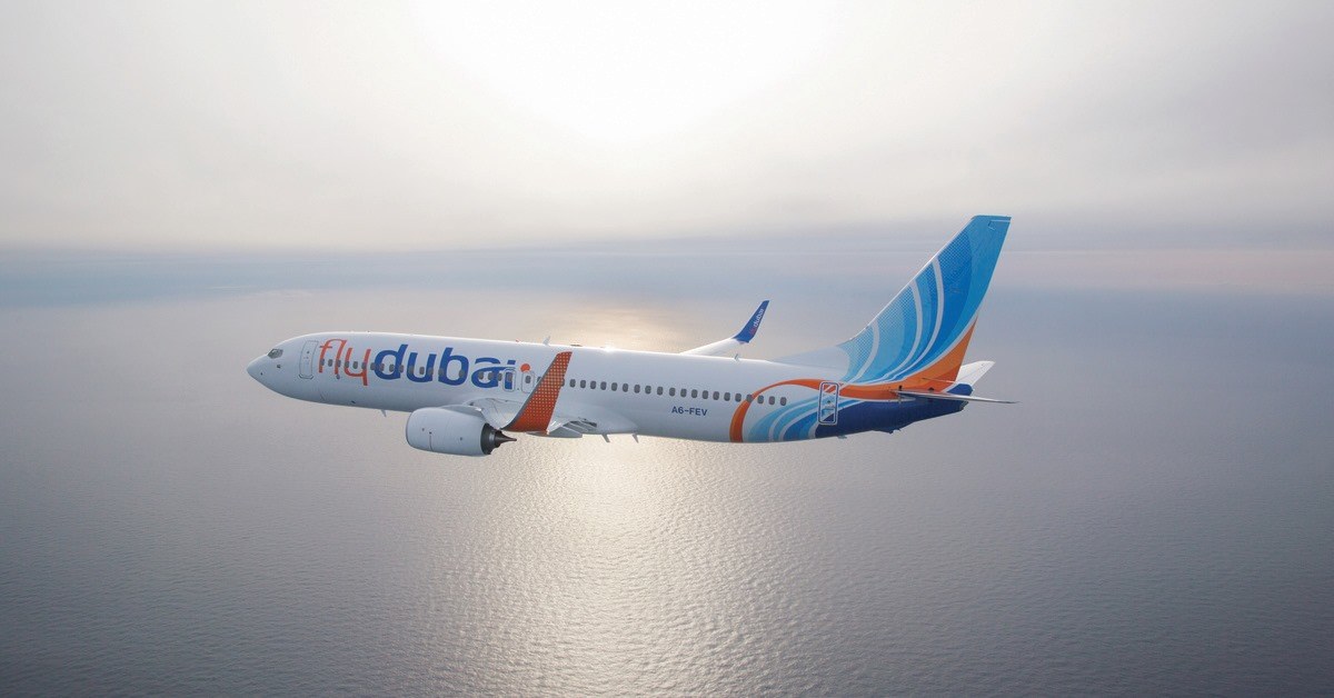 A flydubai aircraft climbing through clouds