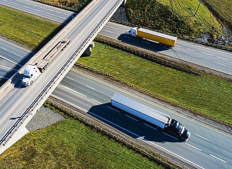 Semi trucks on a highway in daylight