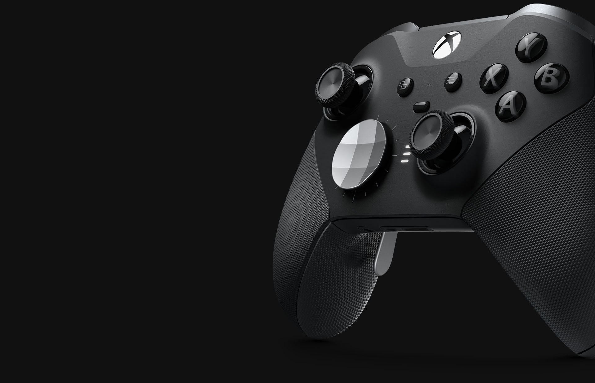 Xbox controllers lined up on a desk