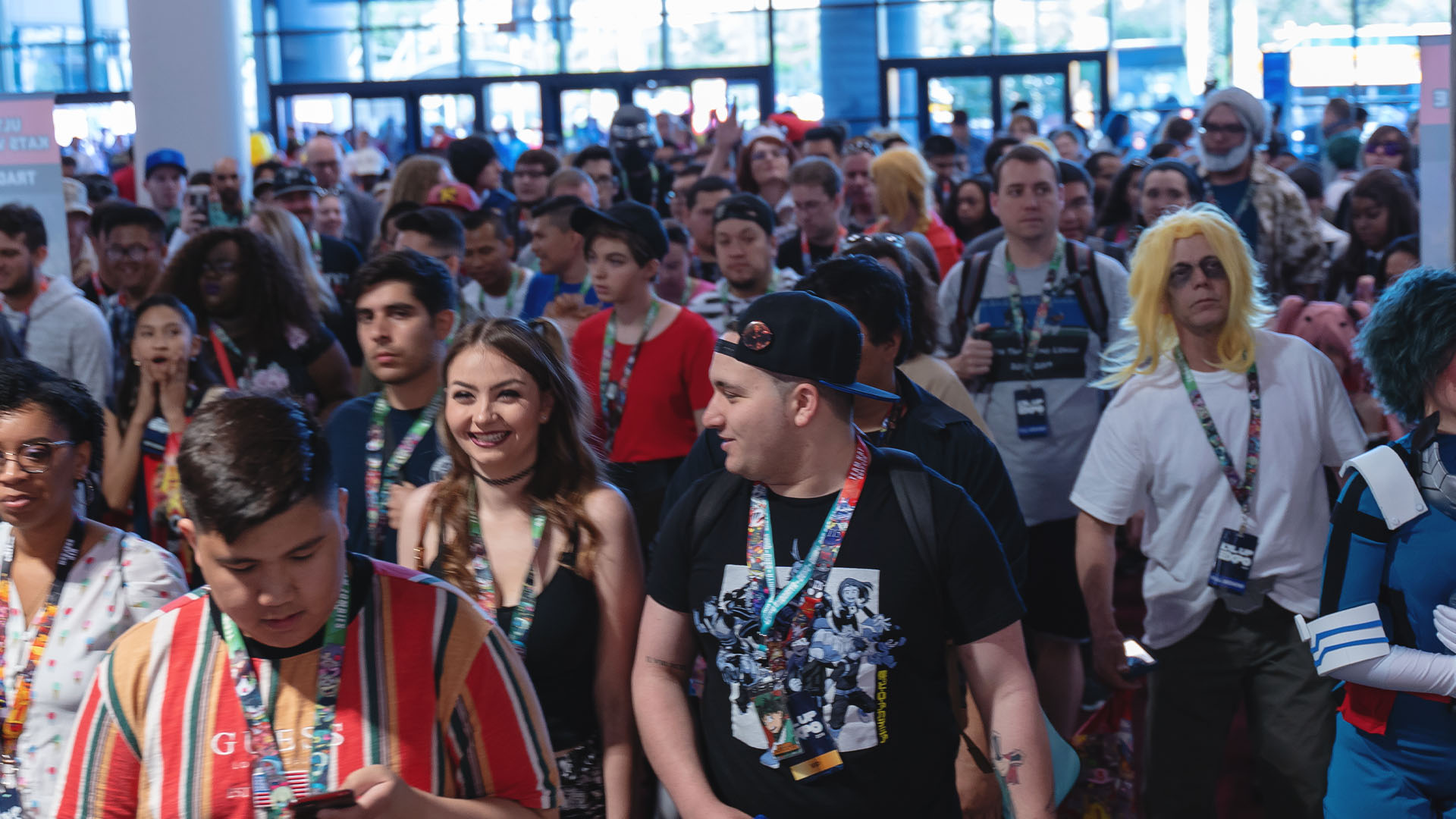A packed crowd of fans with convention badges filling the lobby at LVLUPEXPO 2019