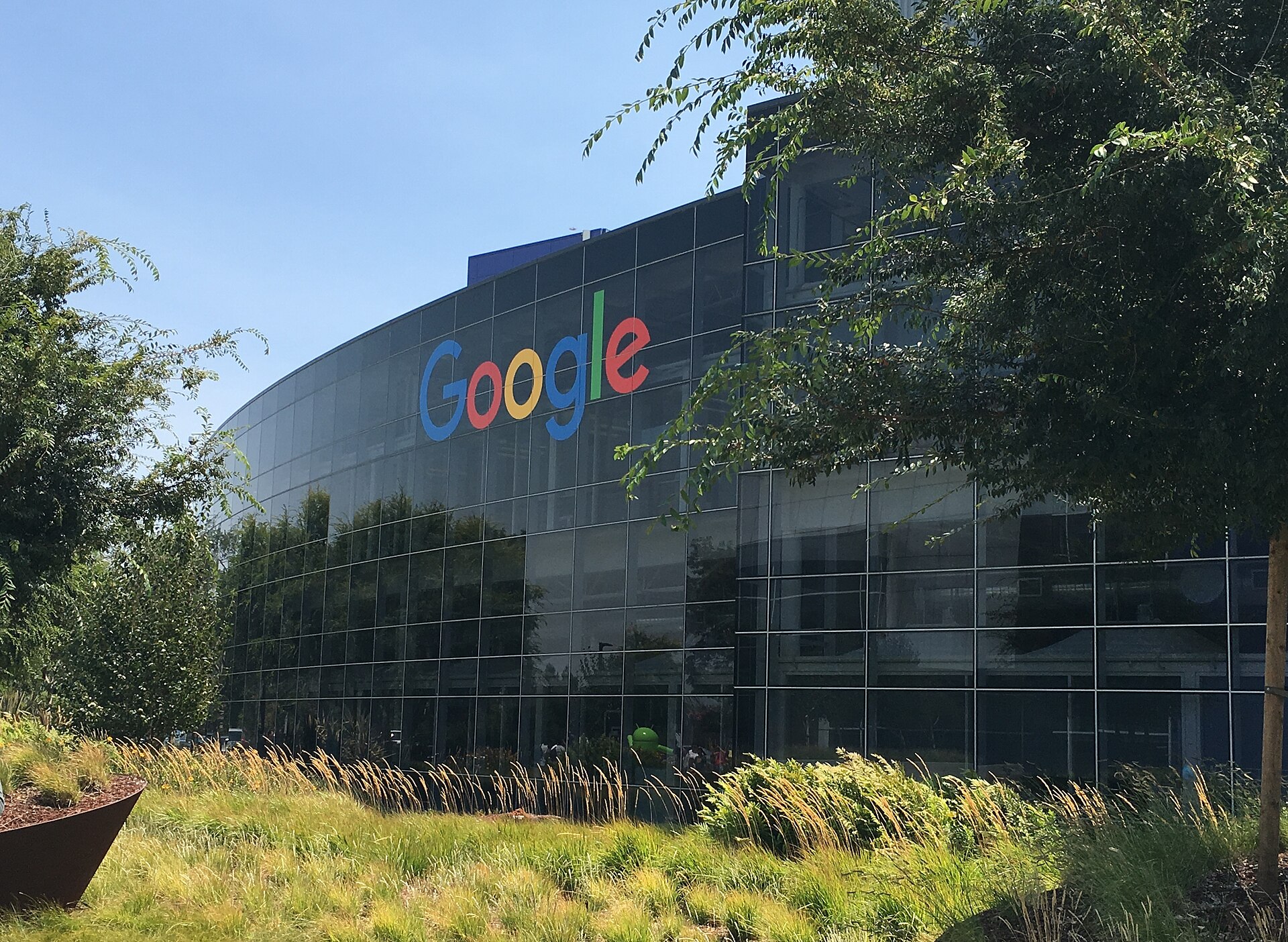 Google's headquarters building in Mountain View, California, with the Google logo on glass