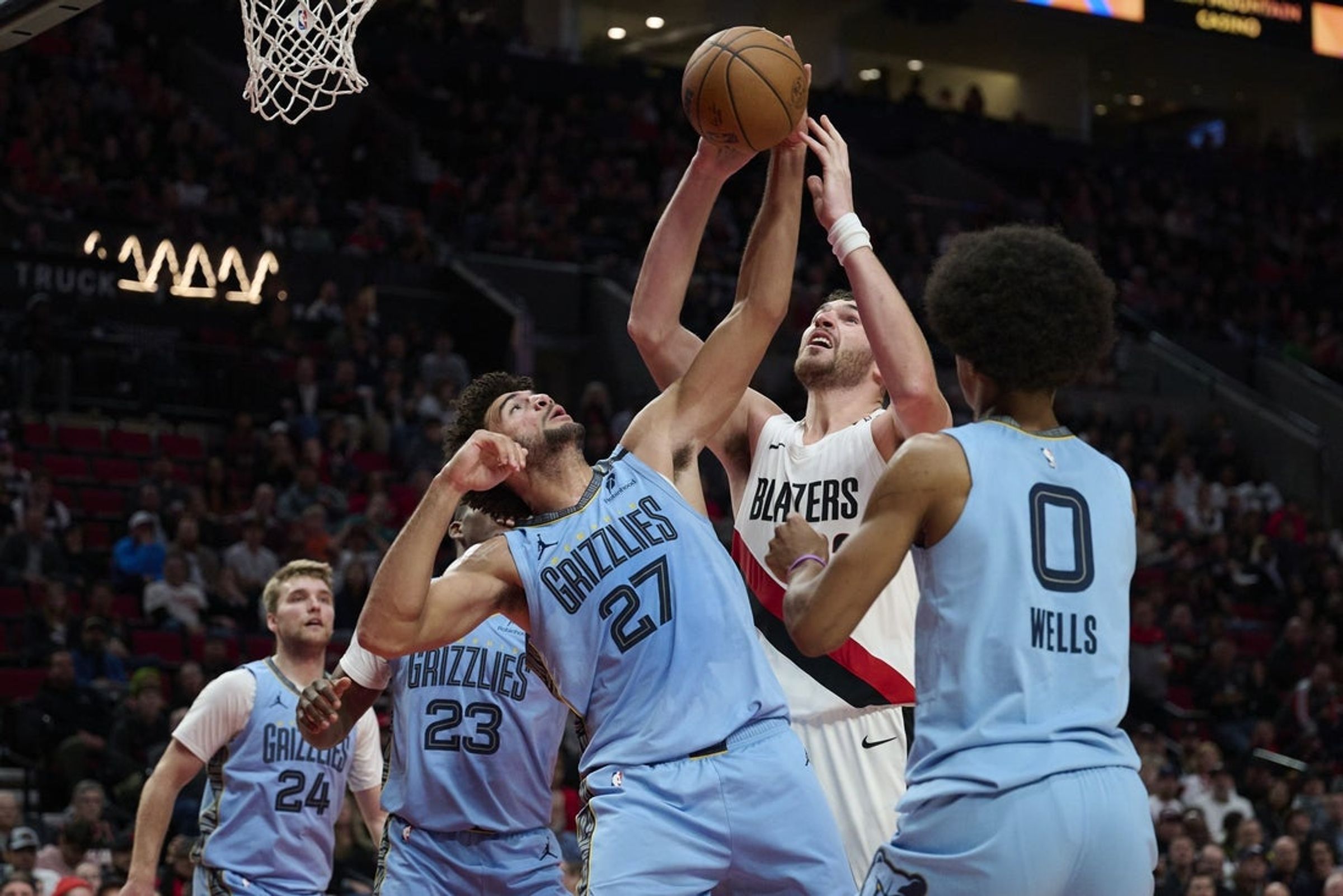 Cameron Boozer of the Memphis Grizzlies (No. 27) battles Portland's Donovan Clingan for a rebound during the first half at Moda Center on October 29, 2026