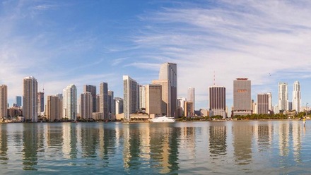 The Miami skyline across Biscayne Bay on a bright day