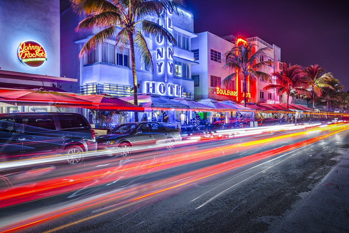 Ocean Drive in Miami Beach at night, neon signs glowing