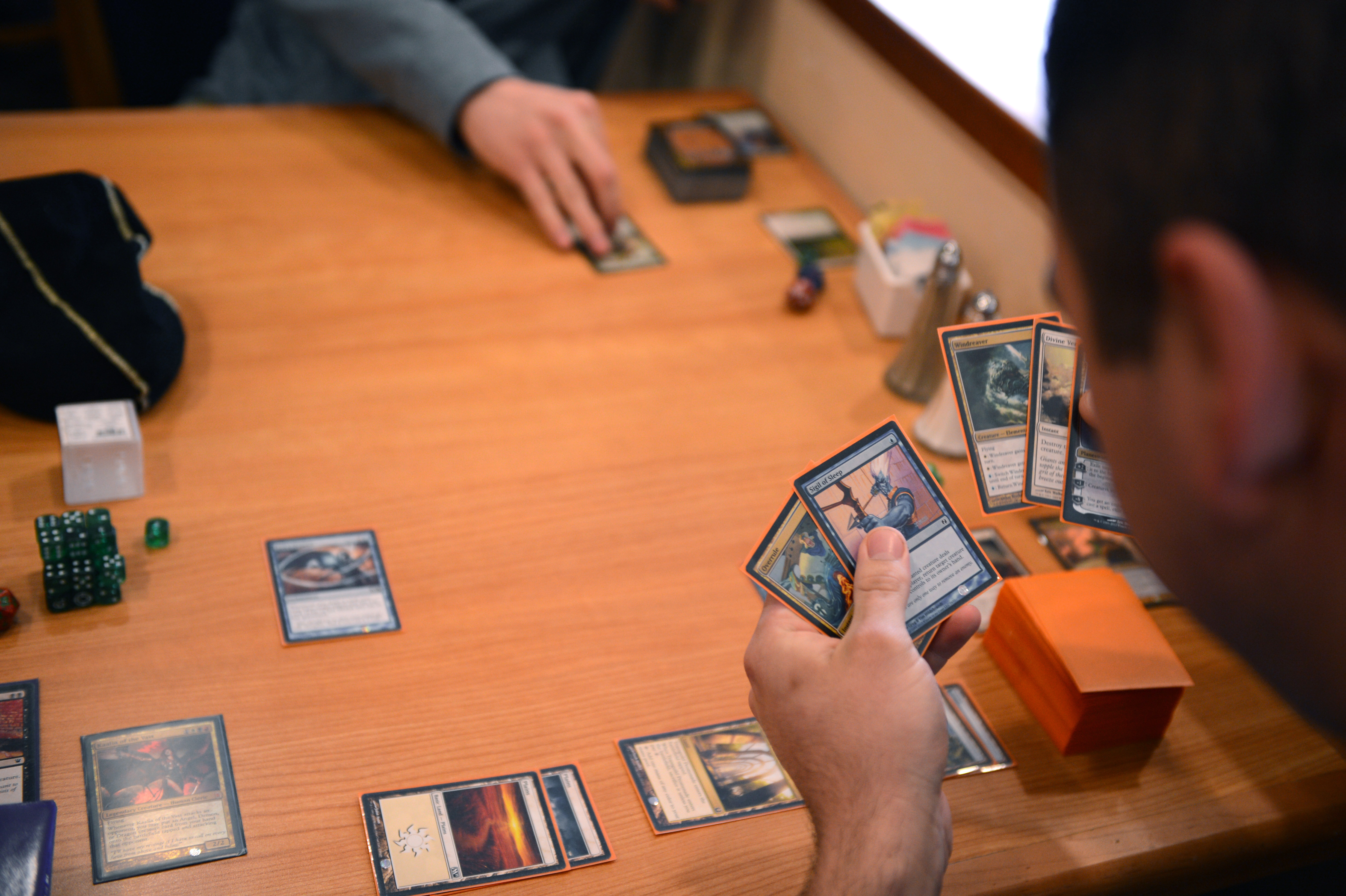Magic: The Gathering players at a game table