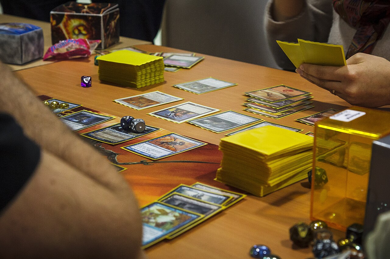 Players at a Magic: The Gathering Commander table