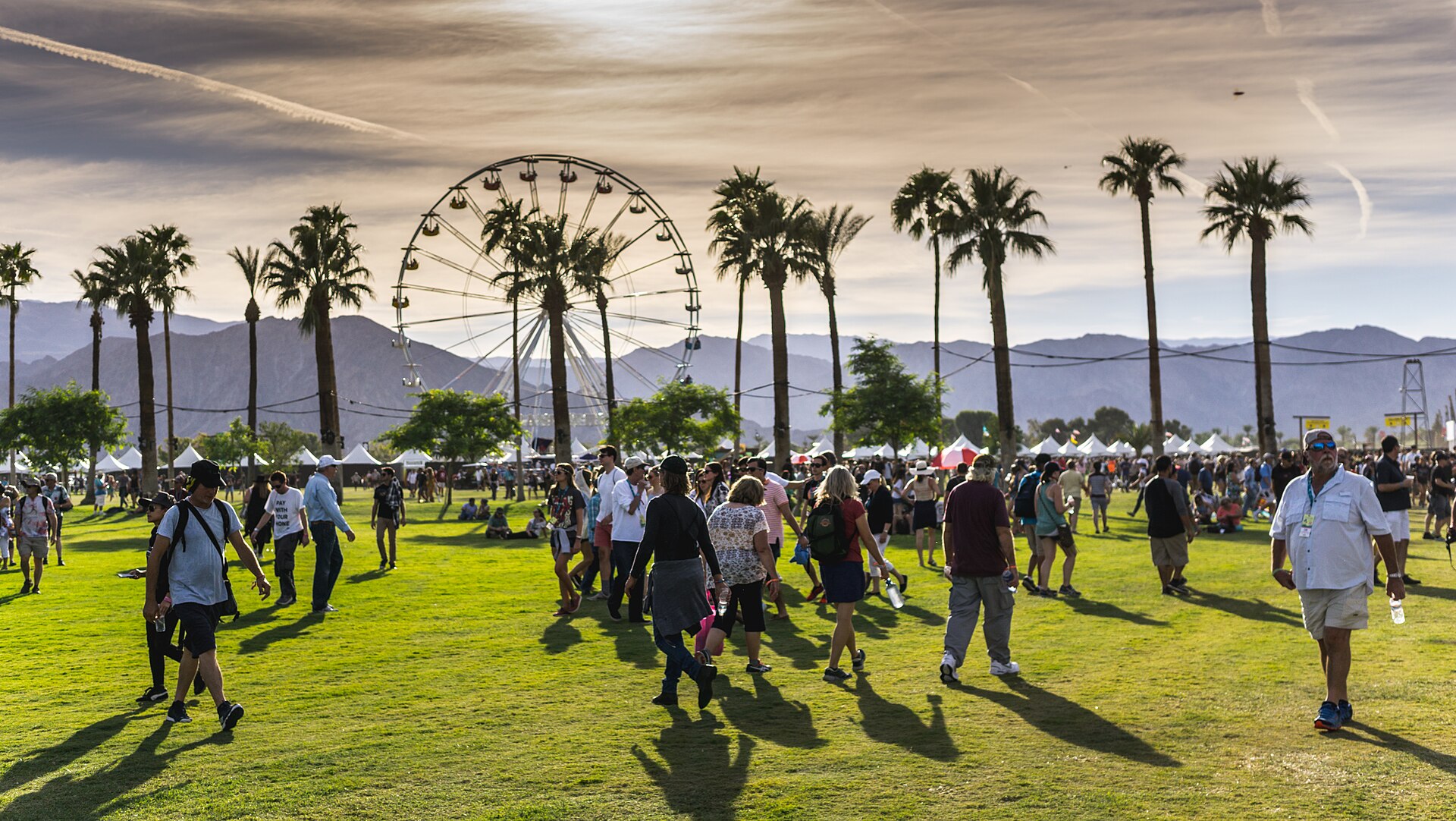 The Empire Polo Club grounds in Indio during Desert Trip 2016, with the Ferris wheel, palm trees and mountains