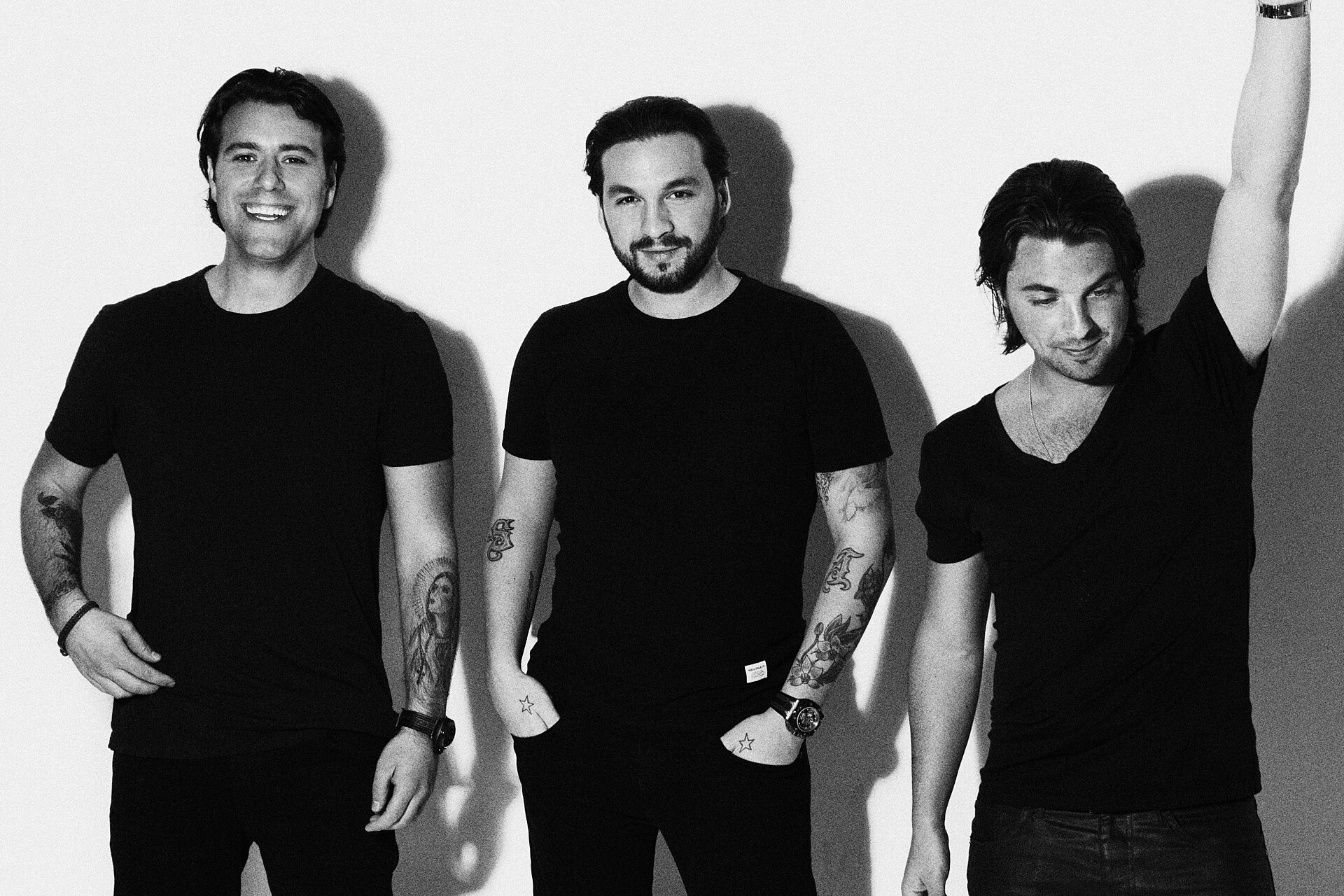 Swedish House Mafia posing for a photo