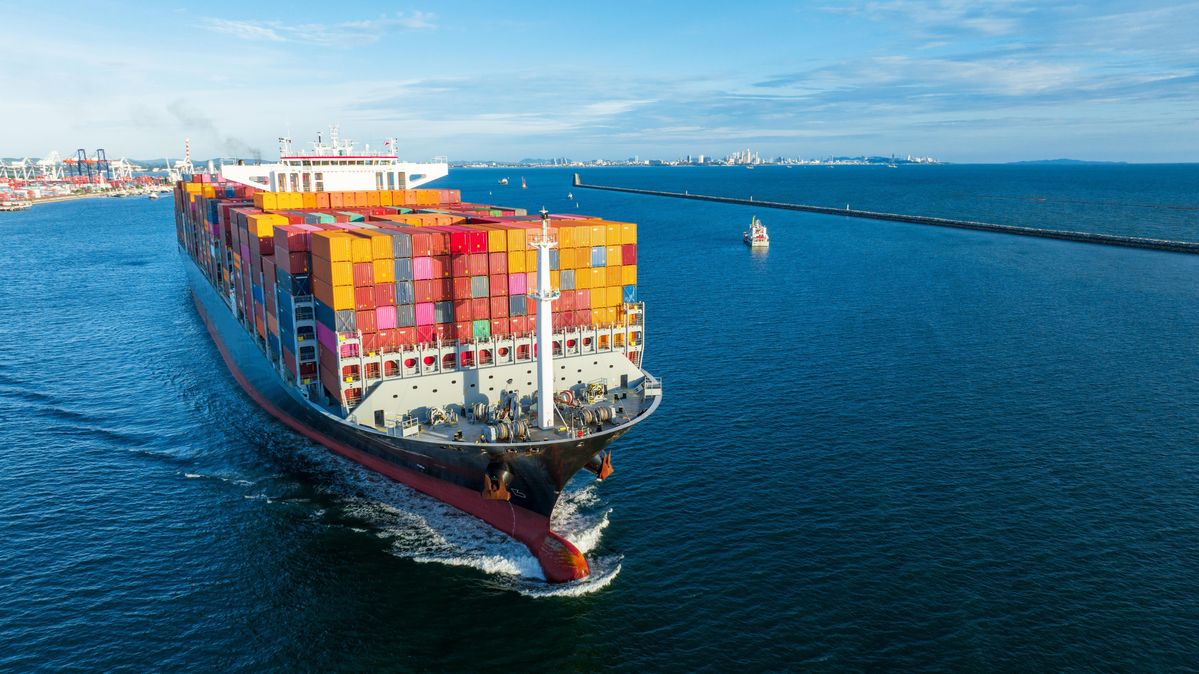 A container ship and tanker underway at sea