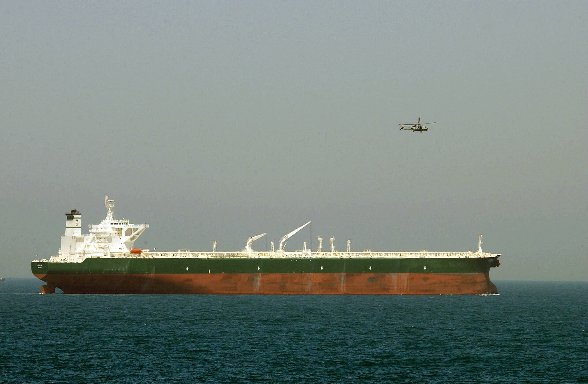 A U.S. Navy helicopter providing aerial security for the commercial oil tanker AbQaiq (file photo)
