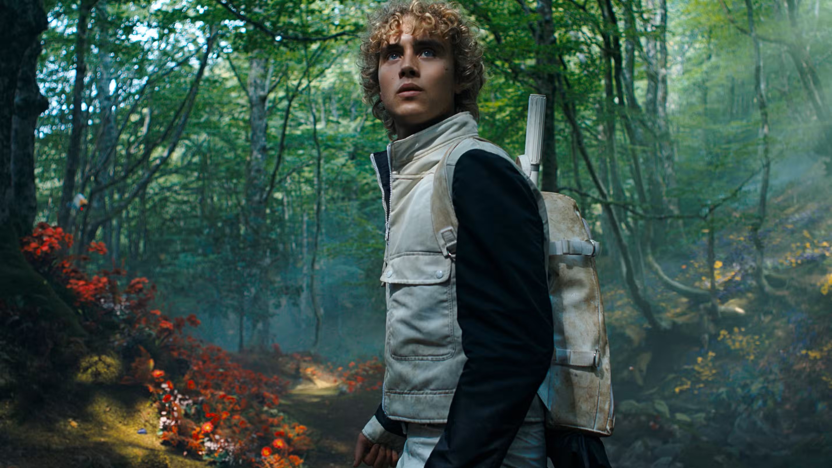 Joseph Zada as young Haymitch Abernathy at the District 12 reaping in The Hunger Games: Sunrise on the Reaping, holding the slip of paper bearing his own name