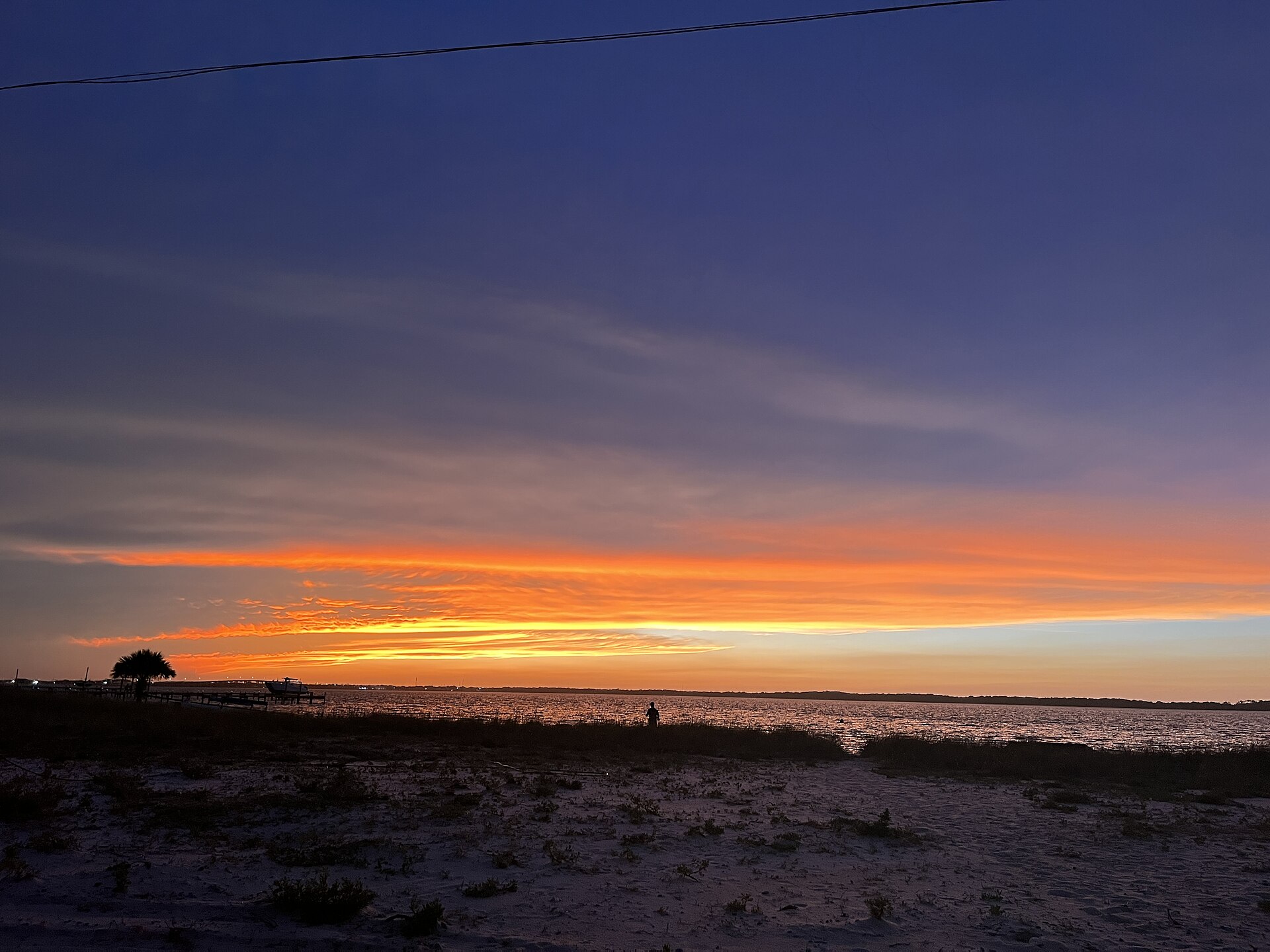 Sunset over Pensacola Beach, Florida — the coastline bracing for Hurricane Isaias as it closes in Friday afternoon