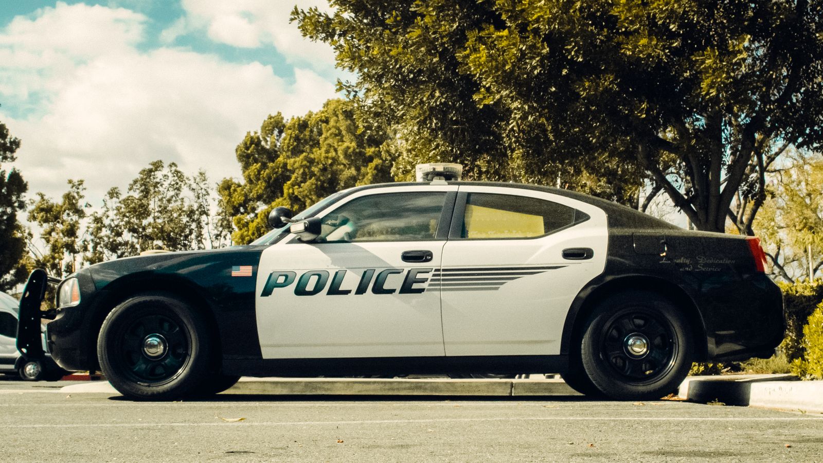 A police vehicle on a city street in daylight