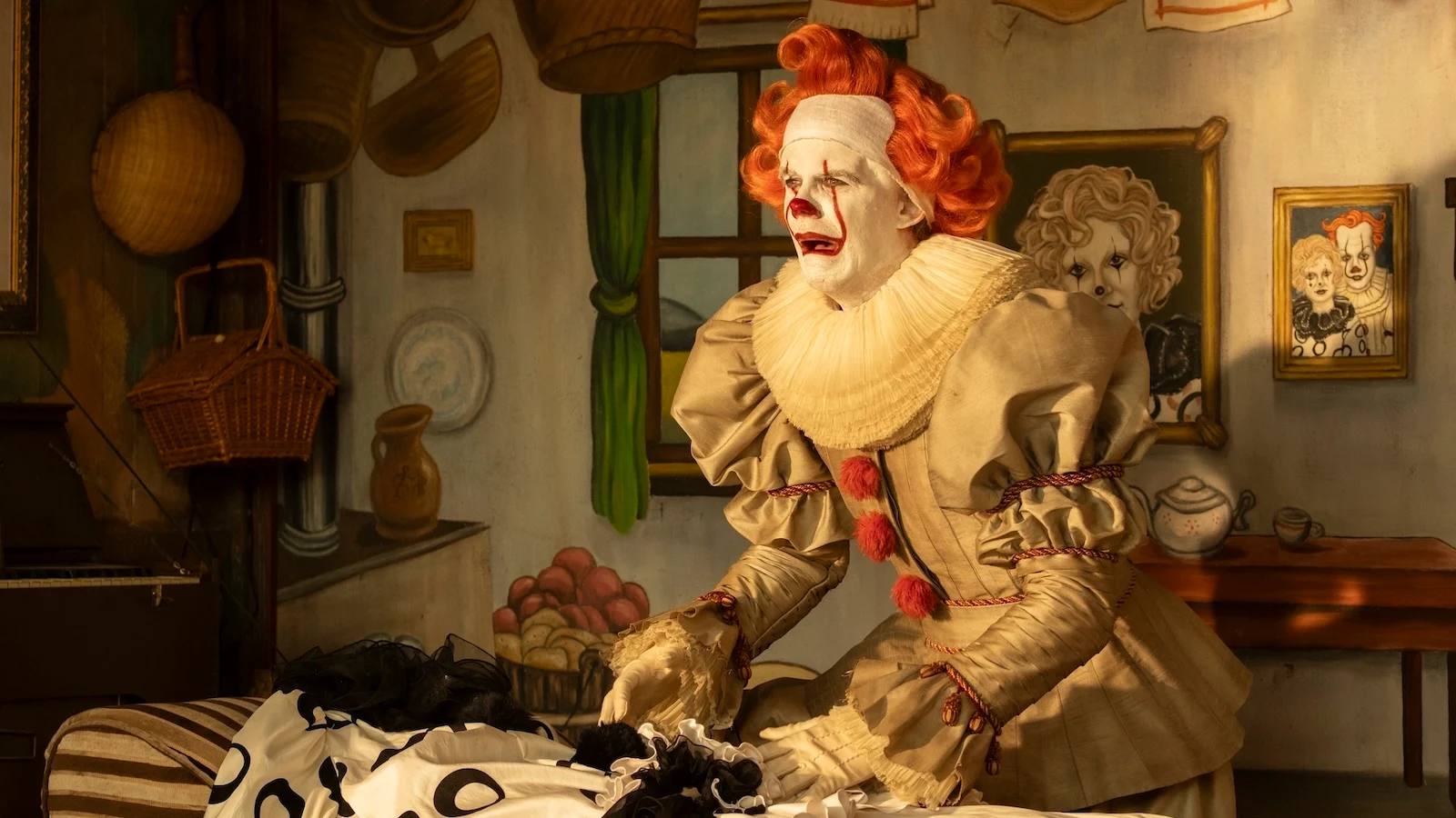 Bill Skarsgård as Bob Gray, the entity's earlier human form, standing in a painted carnival cottage with clown portraits on the wall