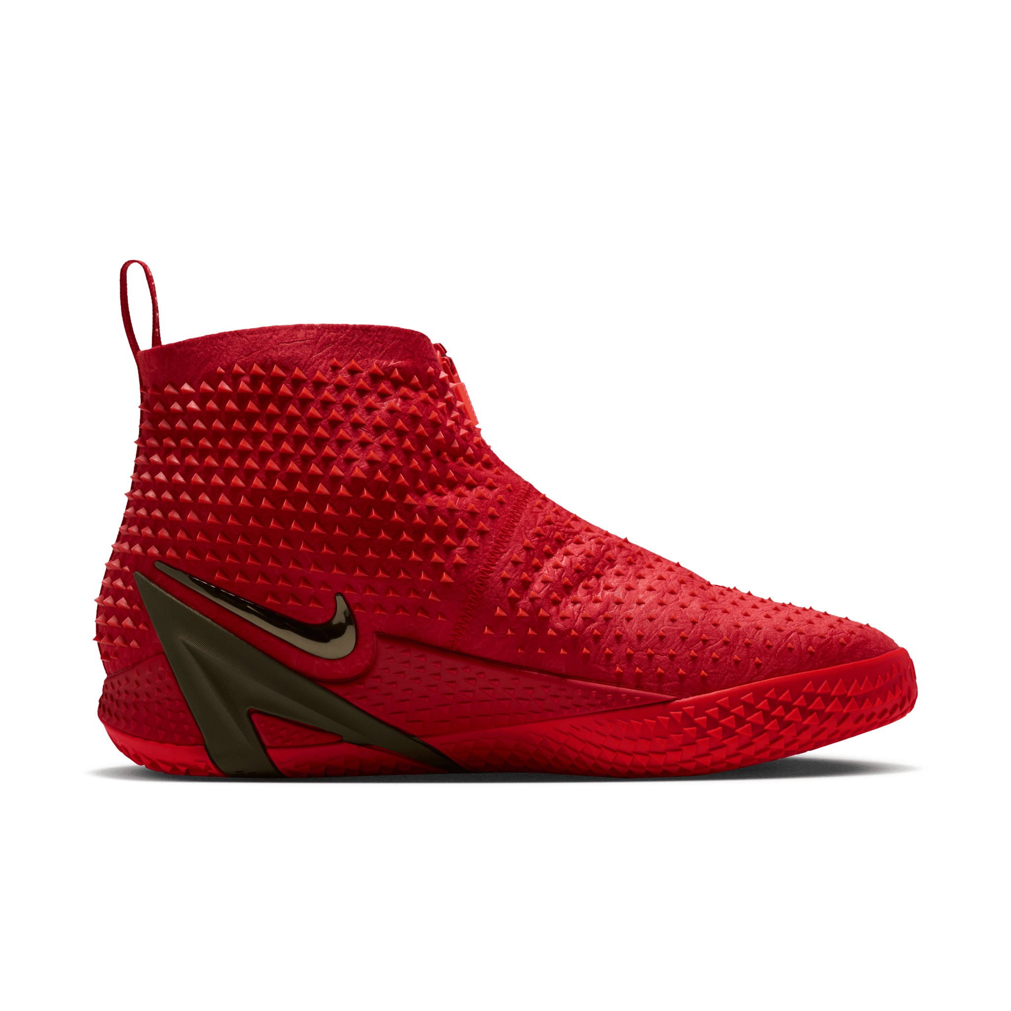 The Nike Ja 4 High “Zombie” in University Red — a tall, zippered shroud covered in triangular studs, with a metallic olive reverse Swoosh and JA-frame at the heel.