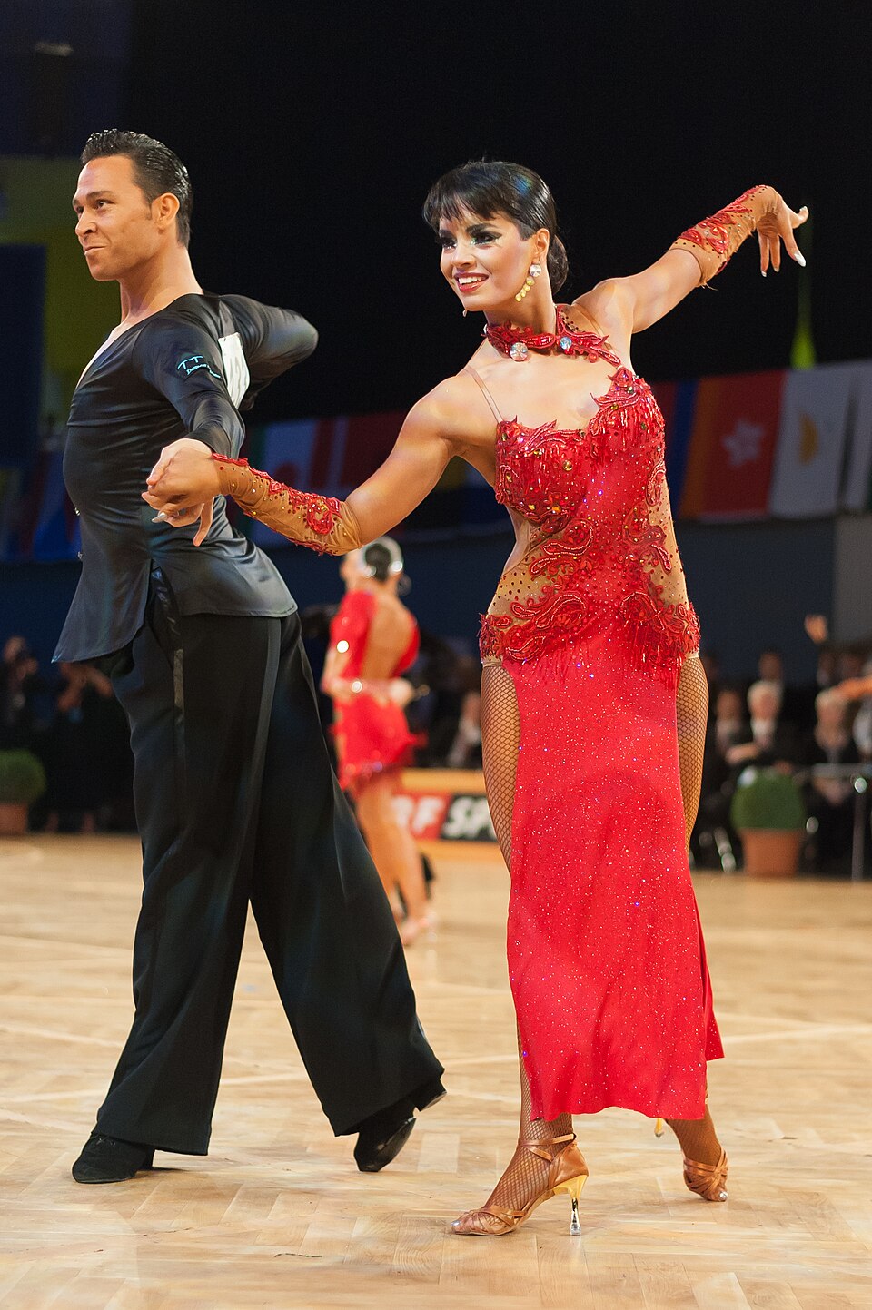 Competitive ballroom dancers in action — Rodriguez has survived week after week on fan votes despite bottom-of-the-leaderboard scores.