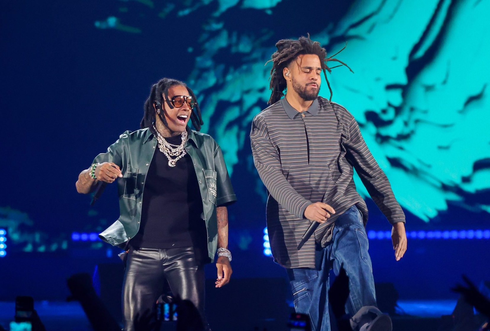 Lil Durk (left, sunglasses and layered chains) and J. Cole performing onstage together at the 2023 iHeartRadio Music Festival at T-Mobile Arena in Las Vegas