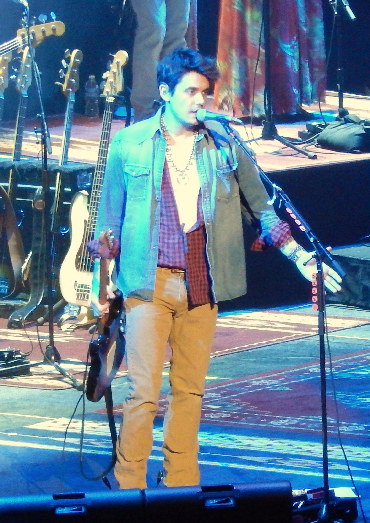 John Mayer performing on stage with his guitar — he's bringing an 18-show residency to the Sphere in 2027