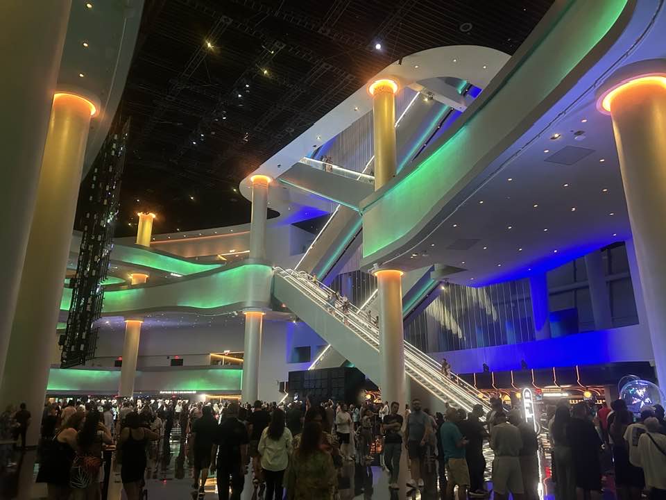 The Sphere's lobby with escalators and a crowd before a show
