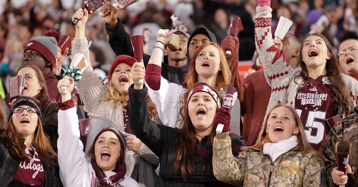 Mississippi State fans cheering with cowbells during a home game
