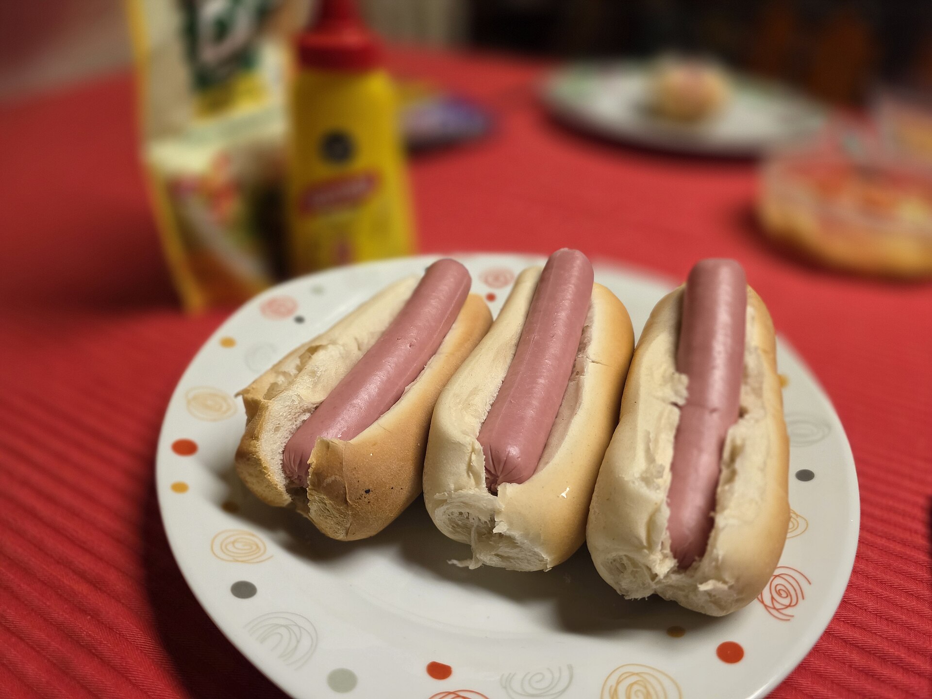 Hot dogs and sausages on a grill, file photo