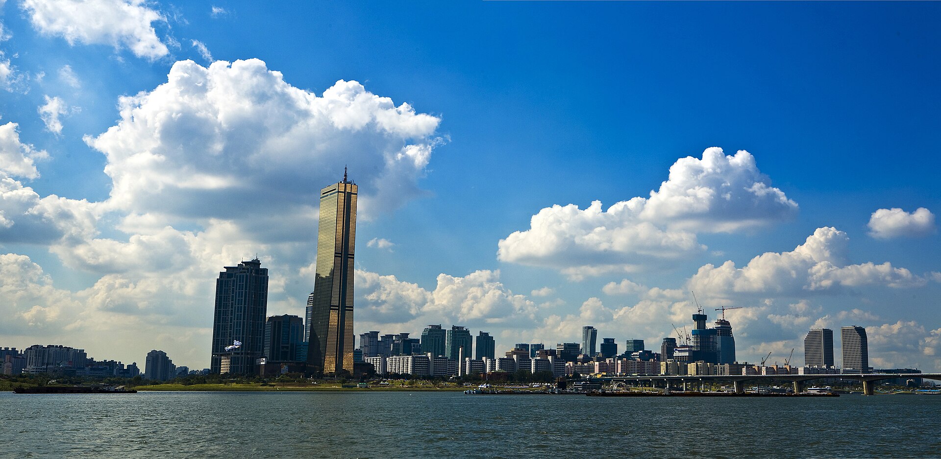 The Seoul skyline in bright daylight, home of the original 2019 film