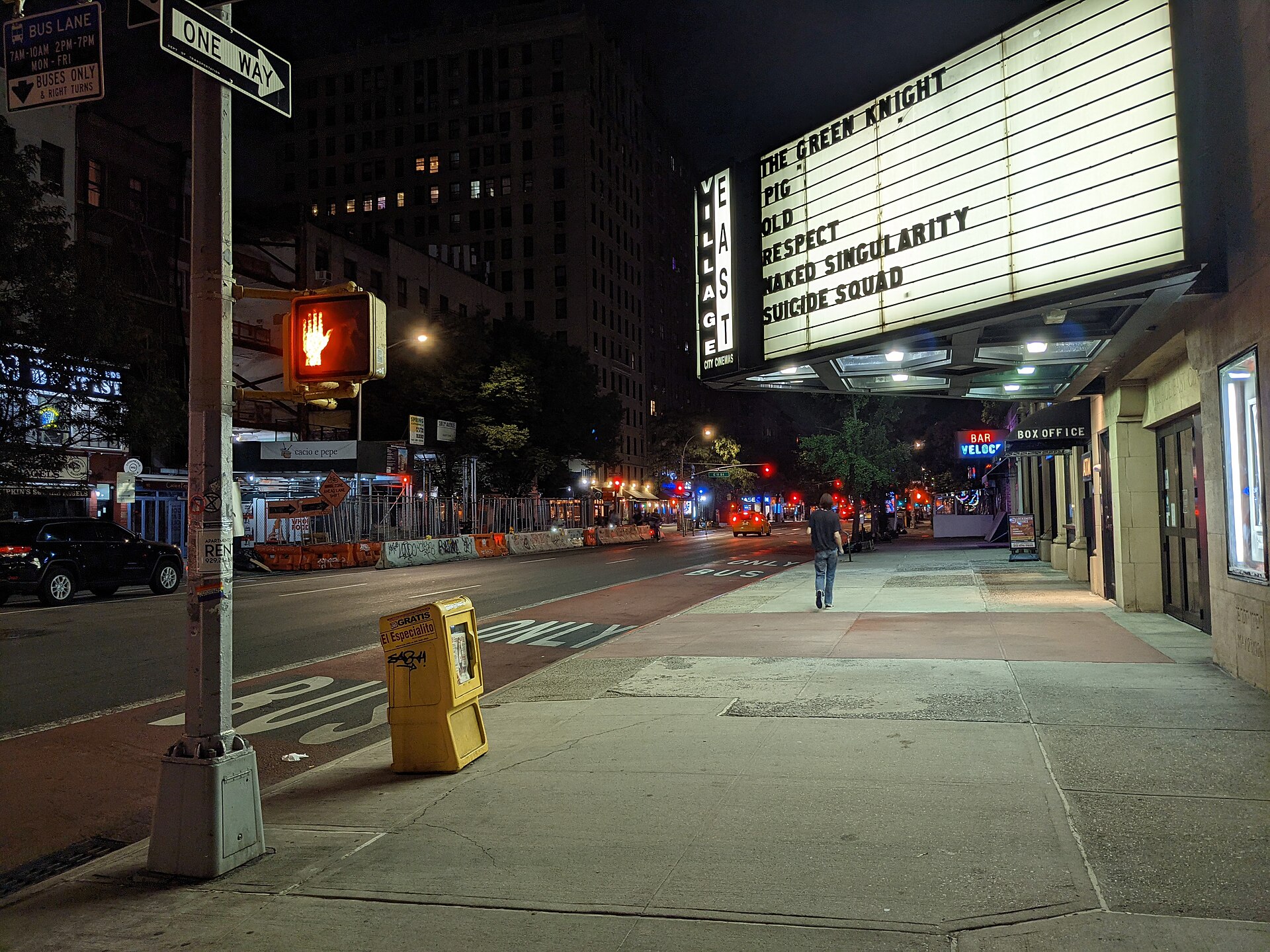 A classic cinema marquee glowing at dusk
