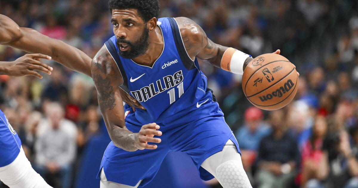 Kyrie Irving handling the ball for the Mavericks — in his last full season he averaged 24.7 points on 47.3% shooting