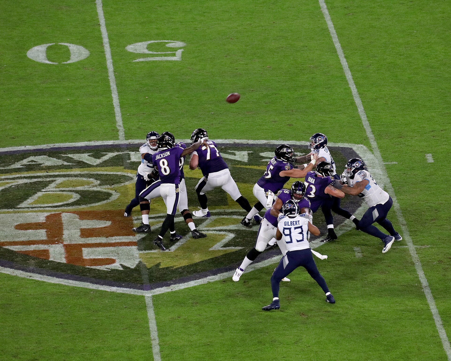 Lamar Jackson throwing a pass for the Baltimore Ravens during a playoff game