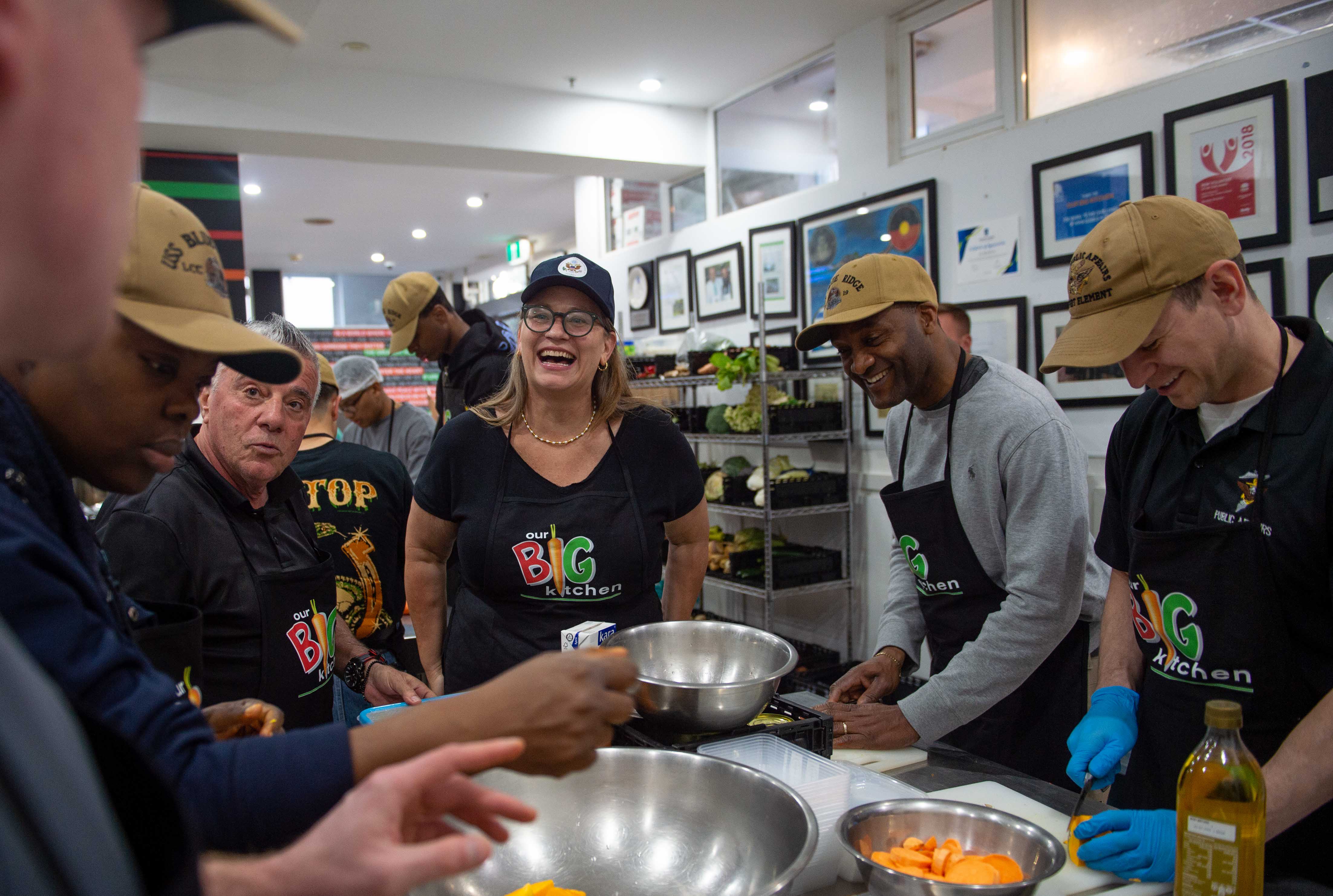Volunteers preparing food for a community food drive