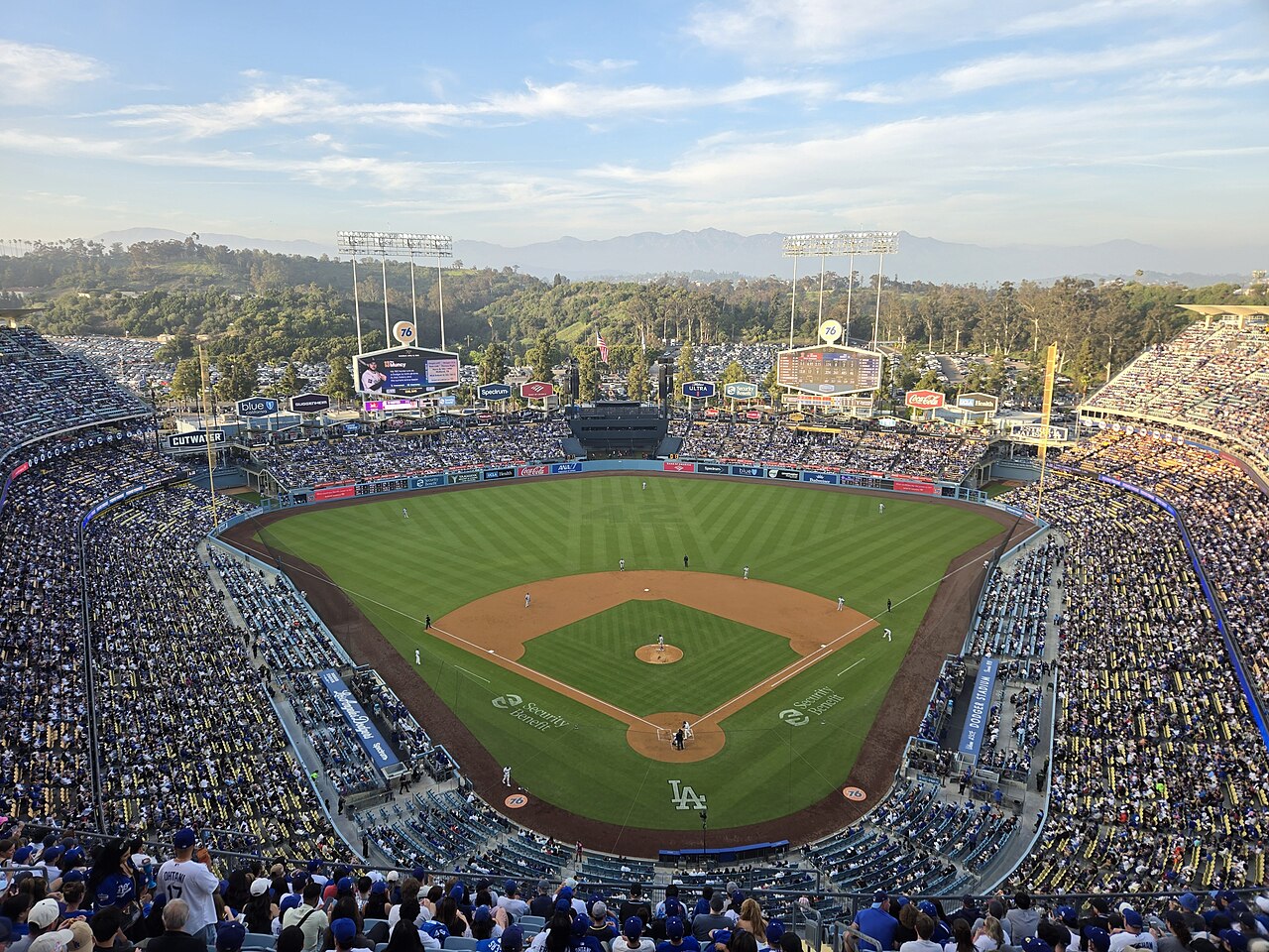 Dodger Stadium packed under a bright blue sky — the Dodgers closed out the Braves 4-1 in NLDS Game 4 on Wednesday night