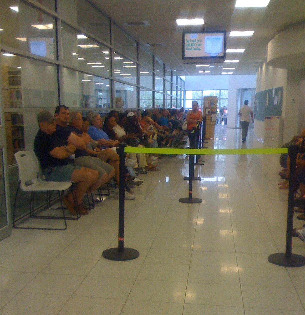 Voters seated inside a polling place waiting to cast ballots