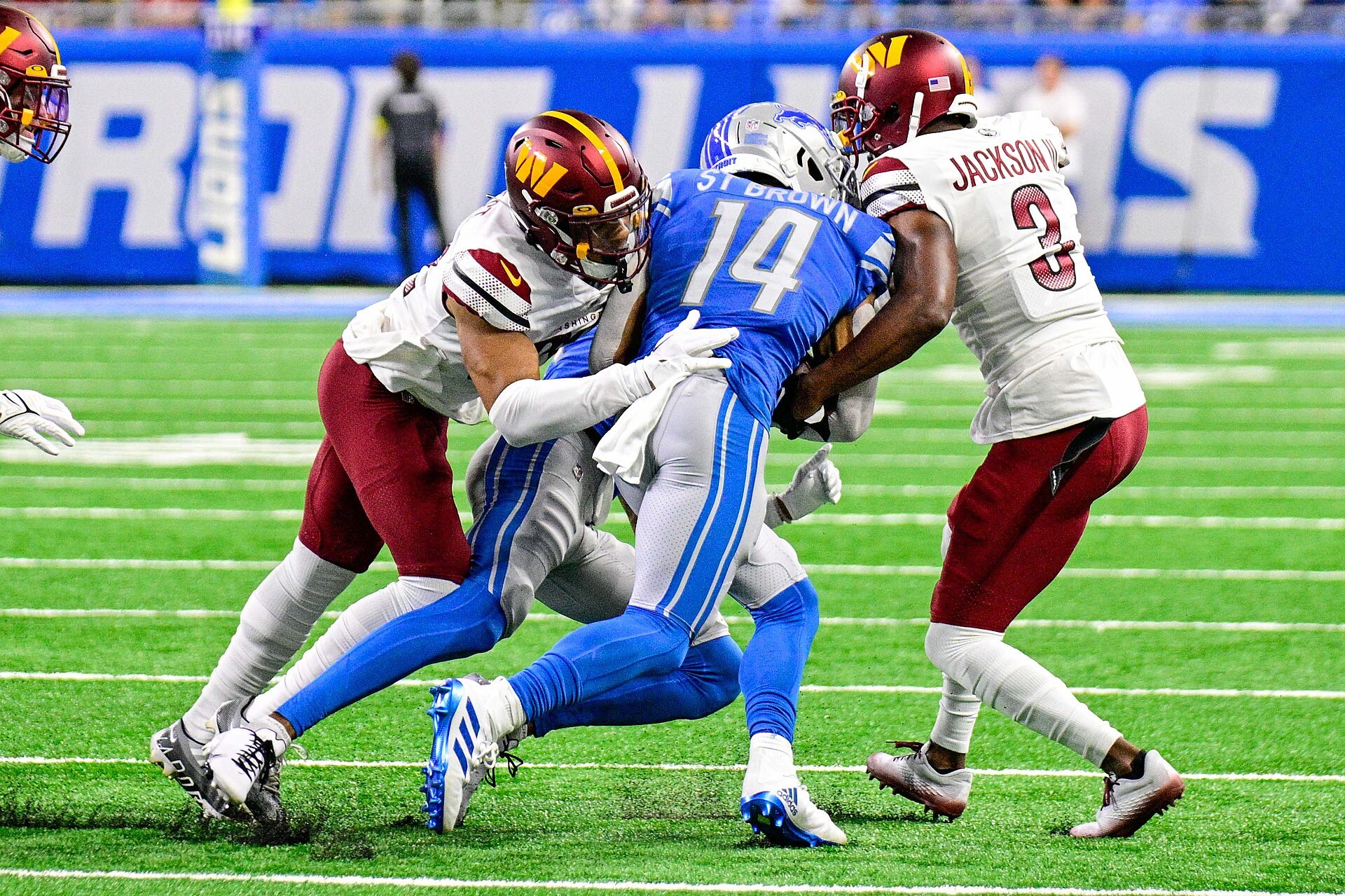 Detroit Lions wide receiver Amon-Ra St. Brown carrying the ball during a game