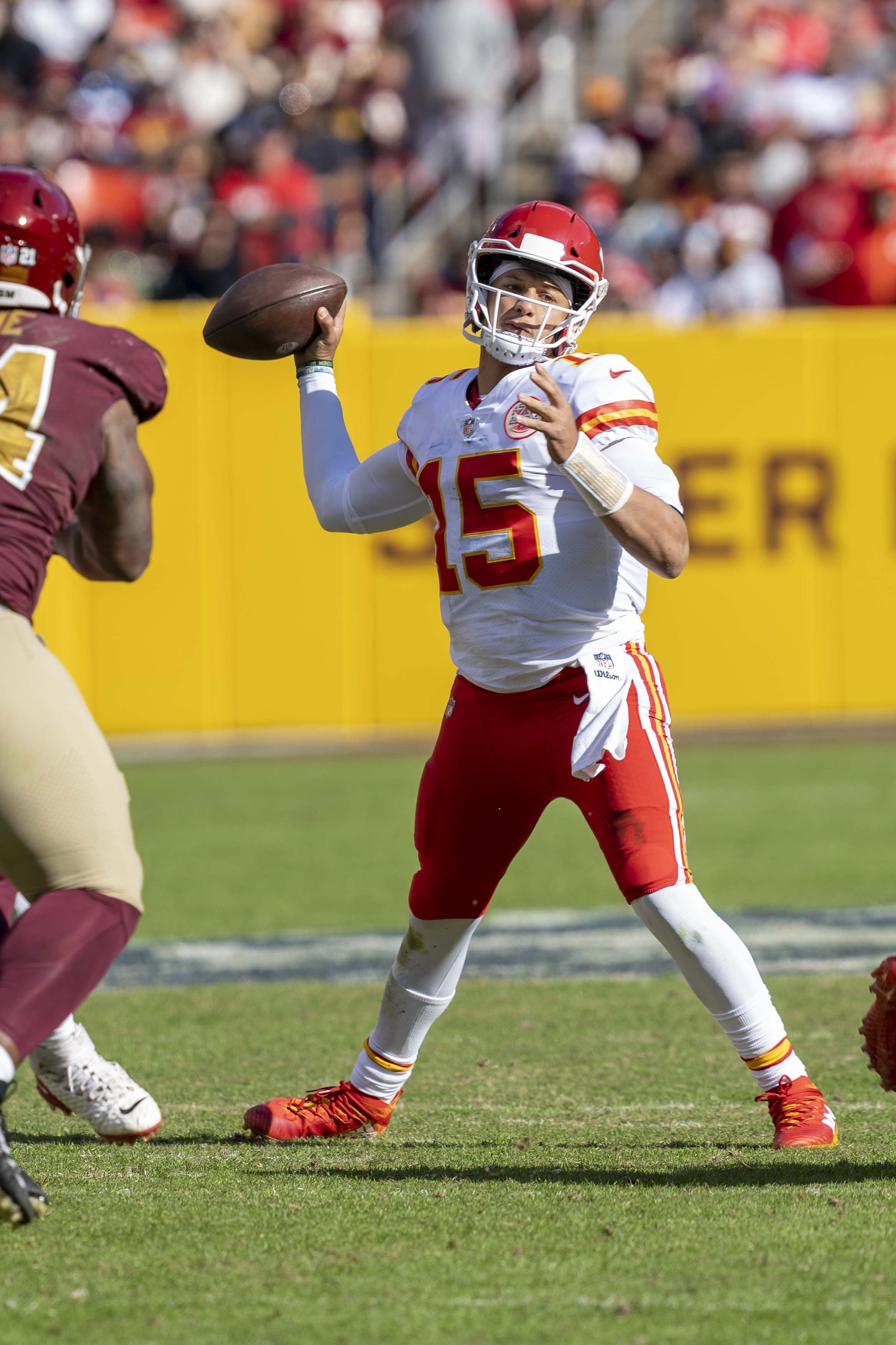 Chiefs quarterback Patrick Mahomes (15) throwing the football during a 2021 game at Washington