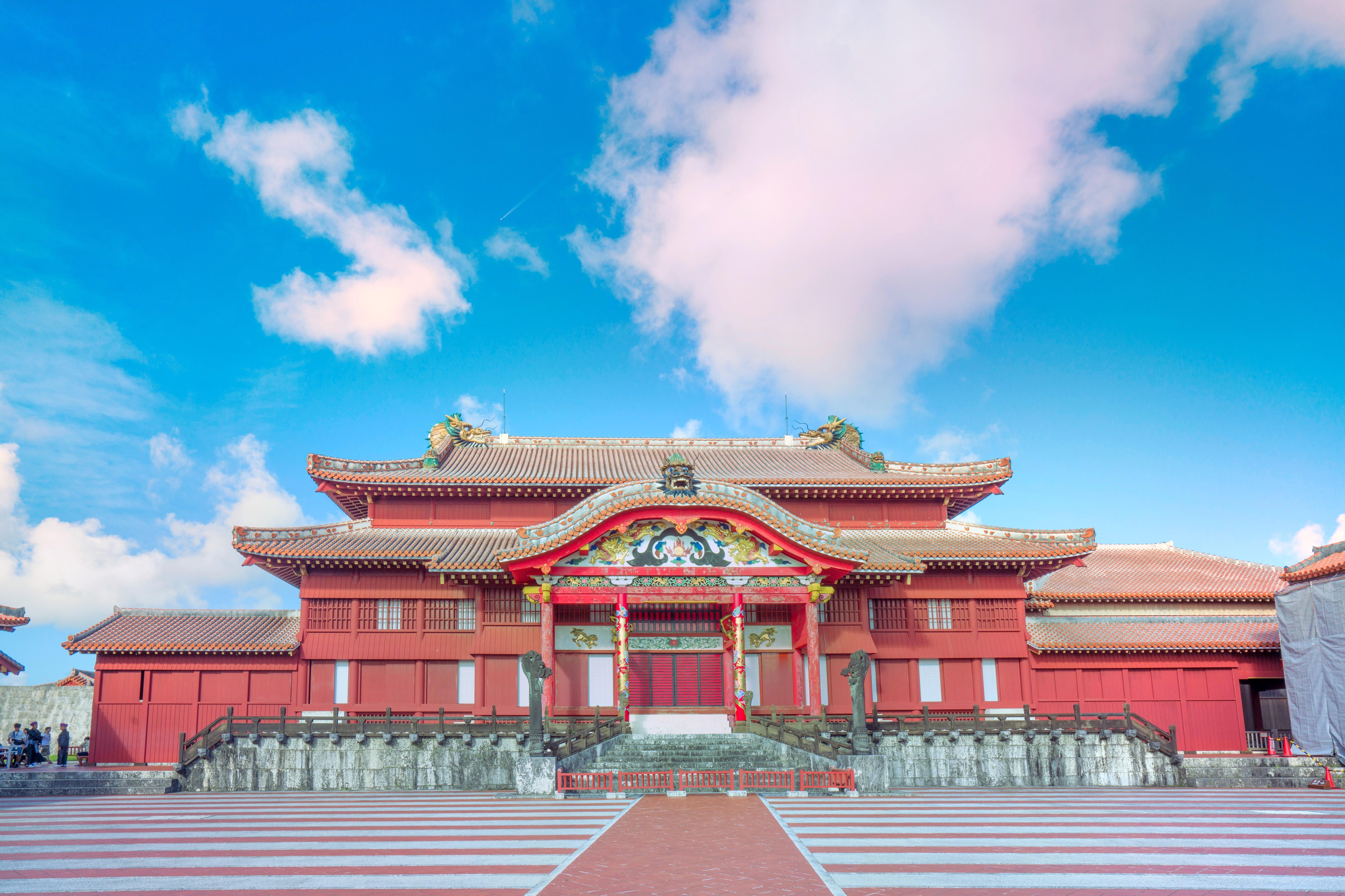 Shuri Castle in Naha, Okinawa, under a clear sky.