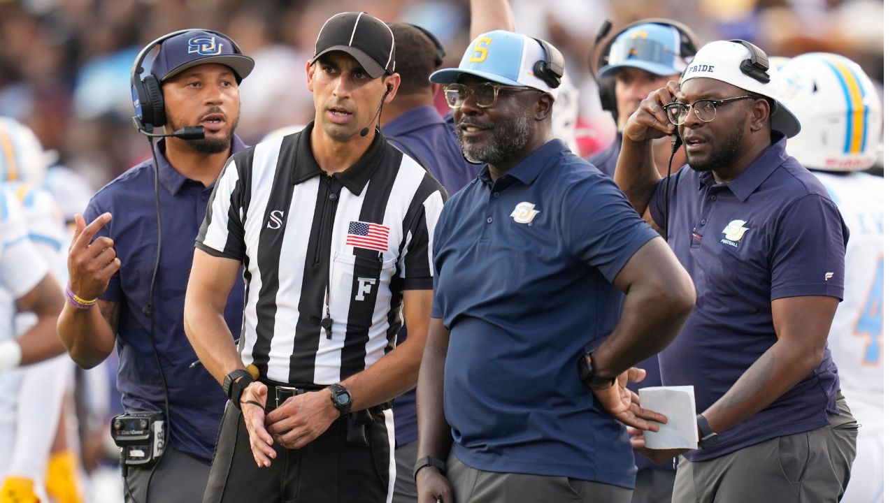 Southern head coach Marshall Faulk talks with an official on the sideline during a 2026 game
