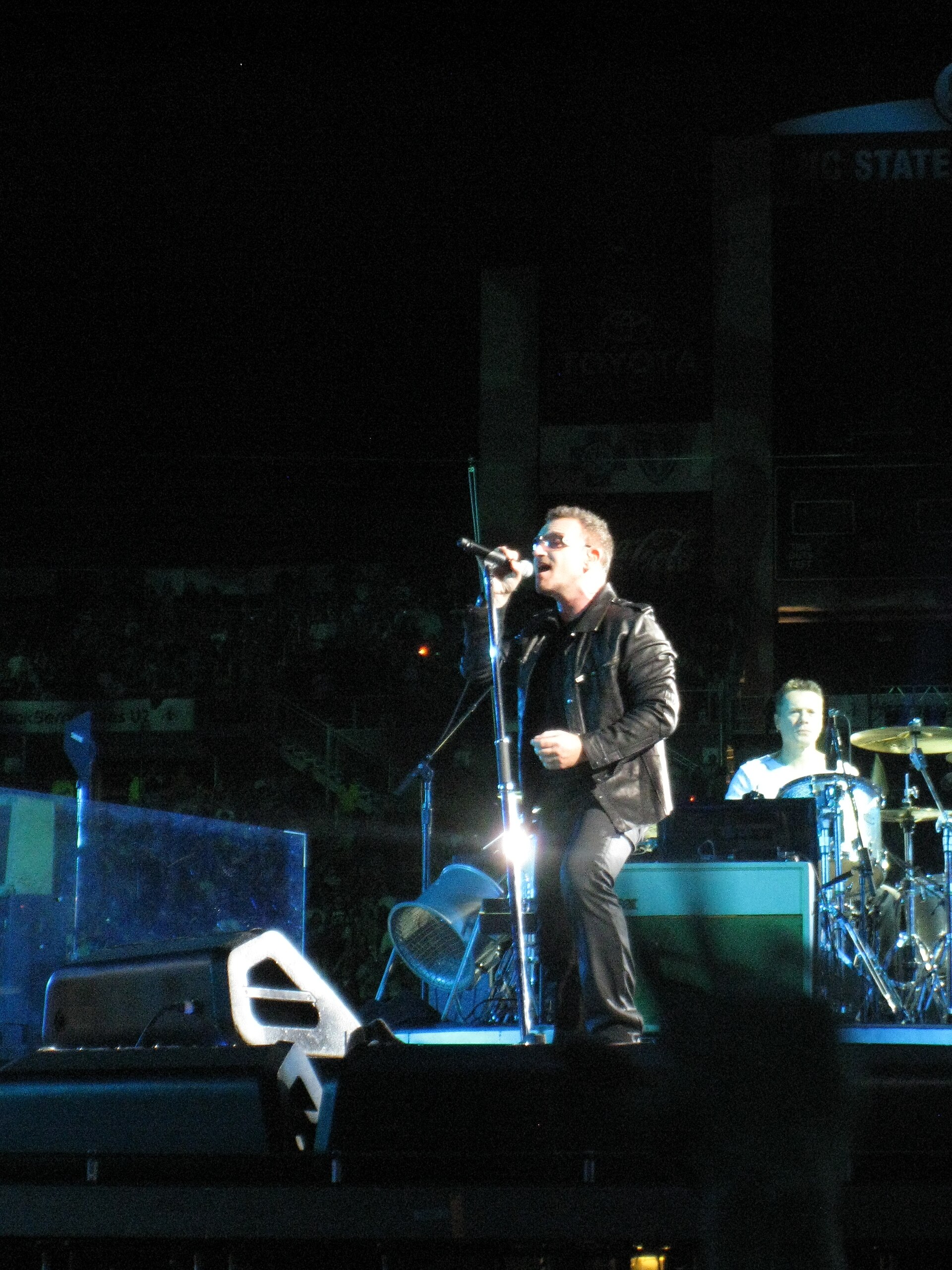 Bono of U2 performing live