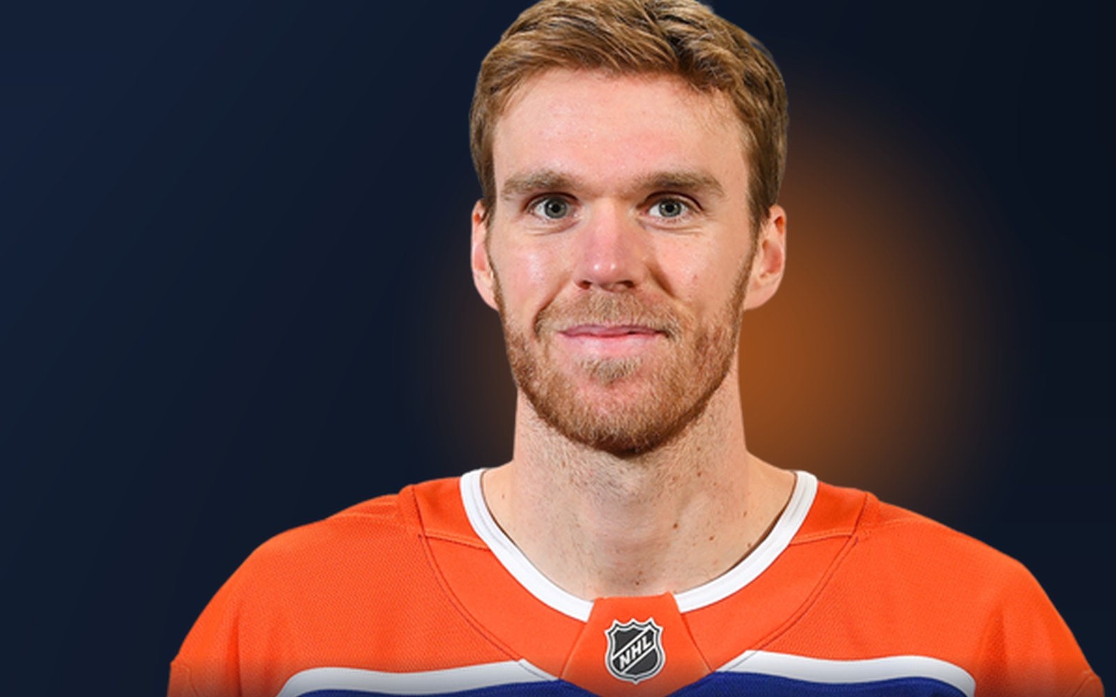 Connor McDavid of the Edmonton Oilers — Previously desk graphic: player cutout of McDavid in the Oilers’ orange home jersey on a dark ground with an Oilers-orange glow
