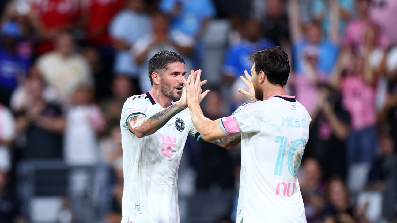 Rodrigo De Paul high-fives Lionel Messi, back to camera in the MESSI 10 shirt, after combining on a goal for Inter Miami against New York City FC