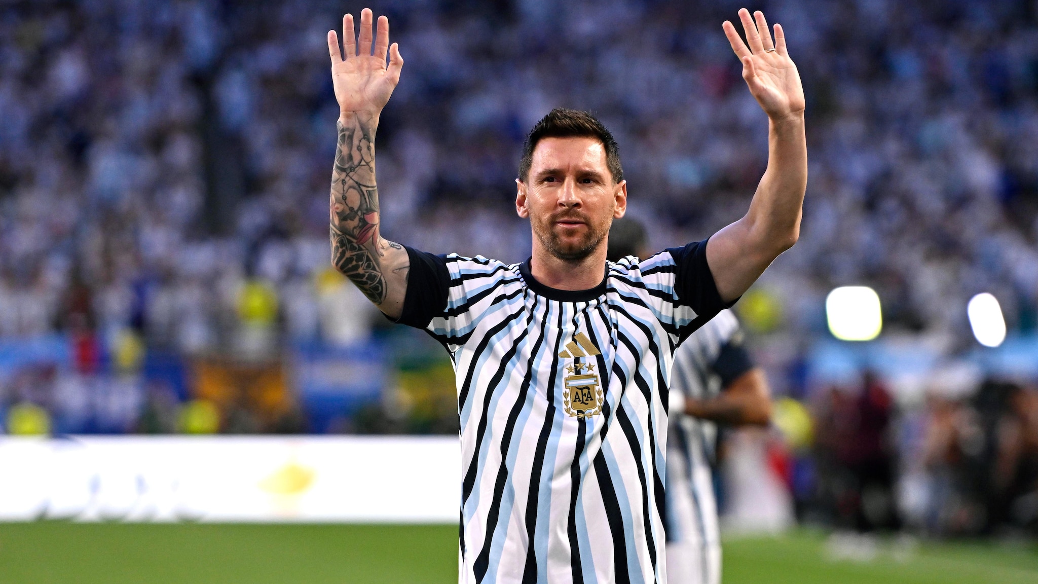 Lionel Messi waves to the crowd after his final Argentina appearance