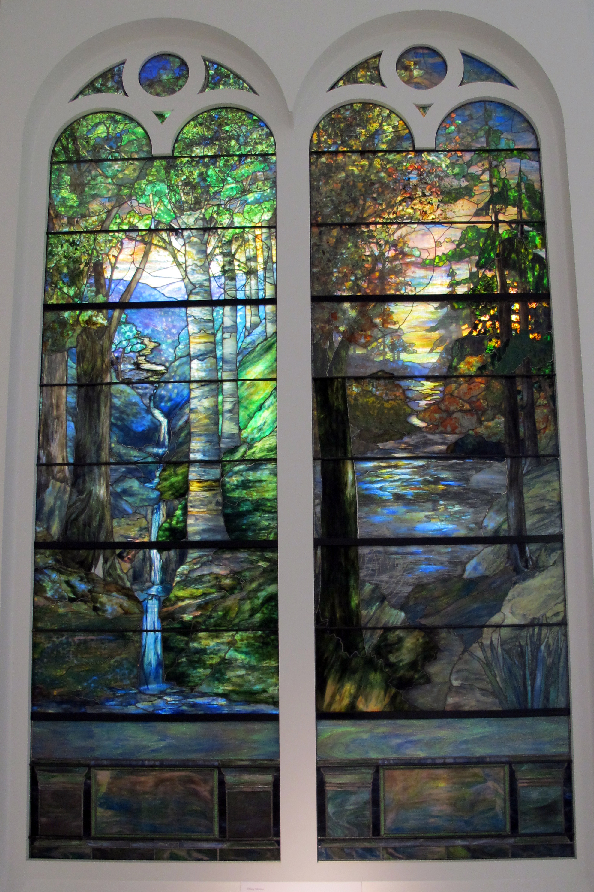 Tiffany Studios stained glass windows glowing in daylight, 1905