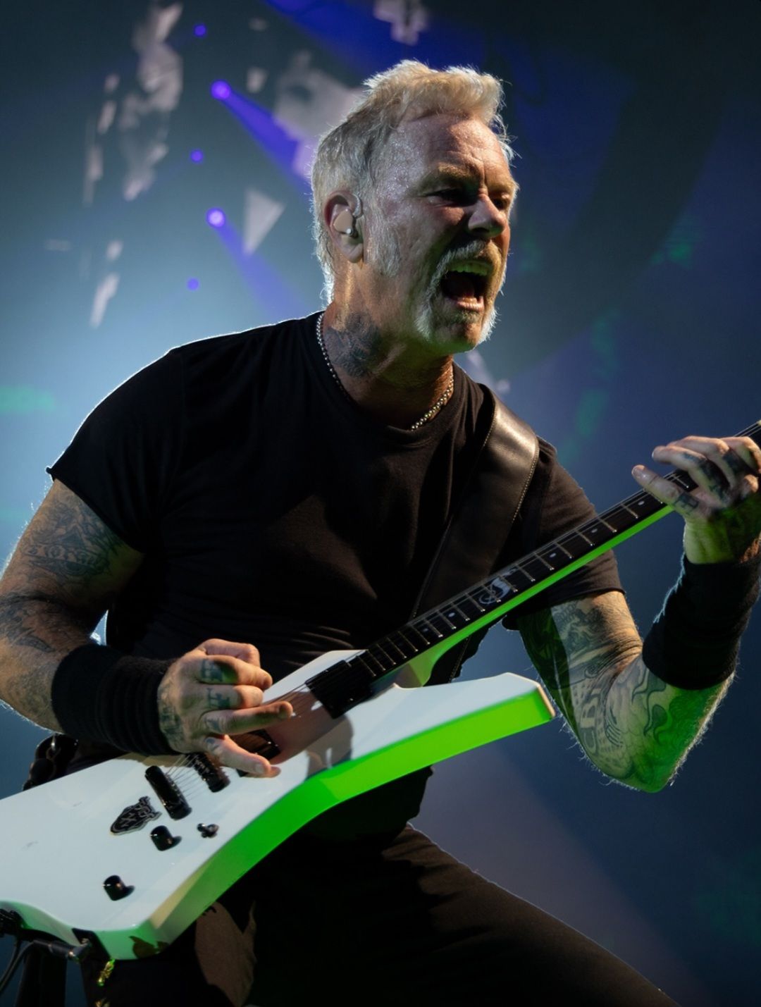 James Hetfield performing on guitar at a Metallica concert