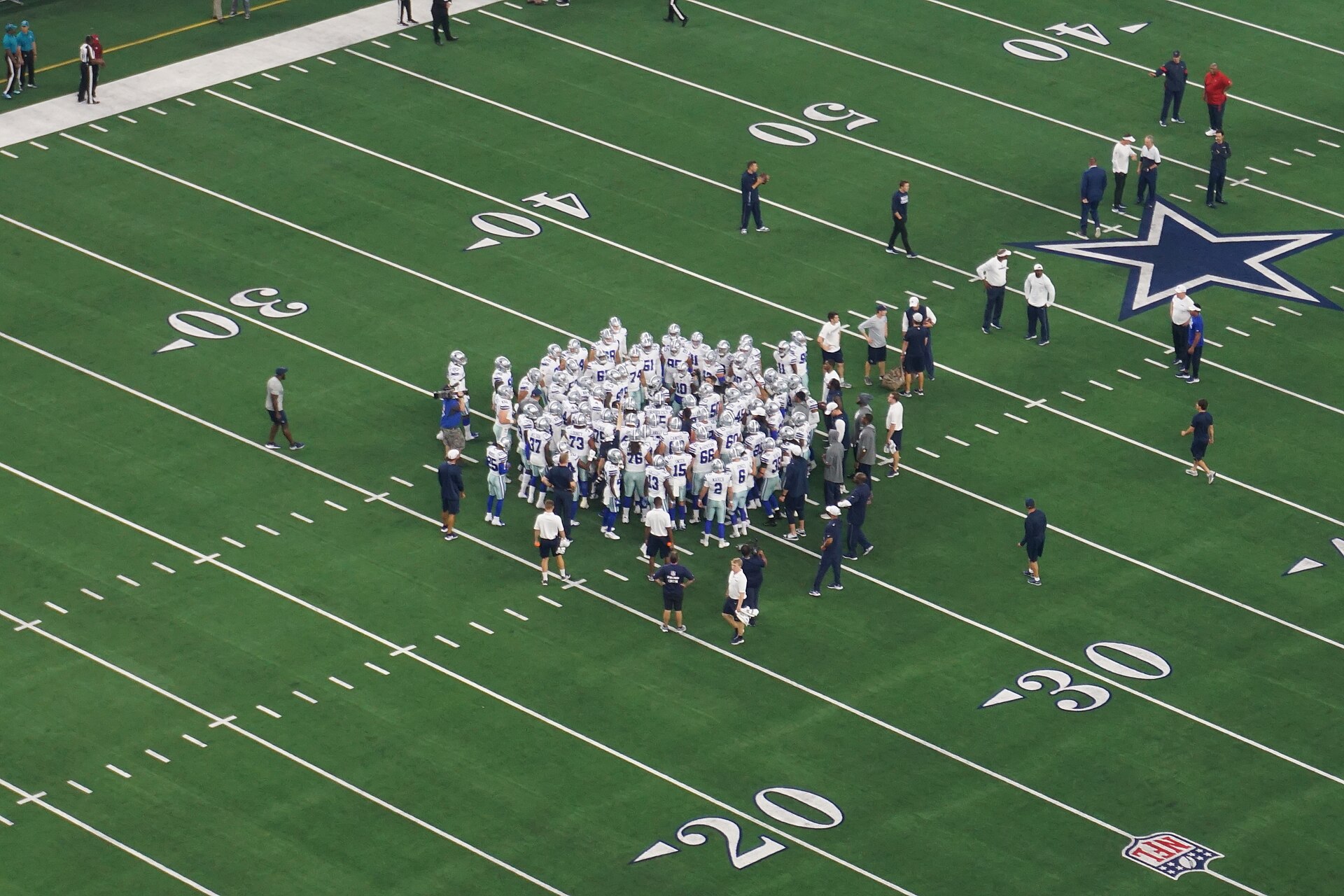 The Dallas Cowboys huddle during an NFL game
