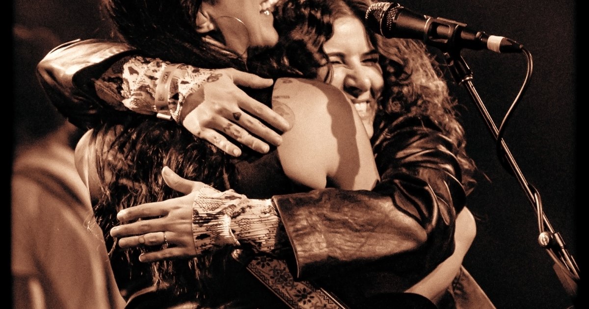 Michelle Branch embracing a guest on stage at the Fonda Theatre in Los Angeles in October 2023