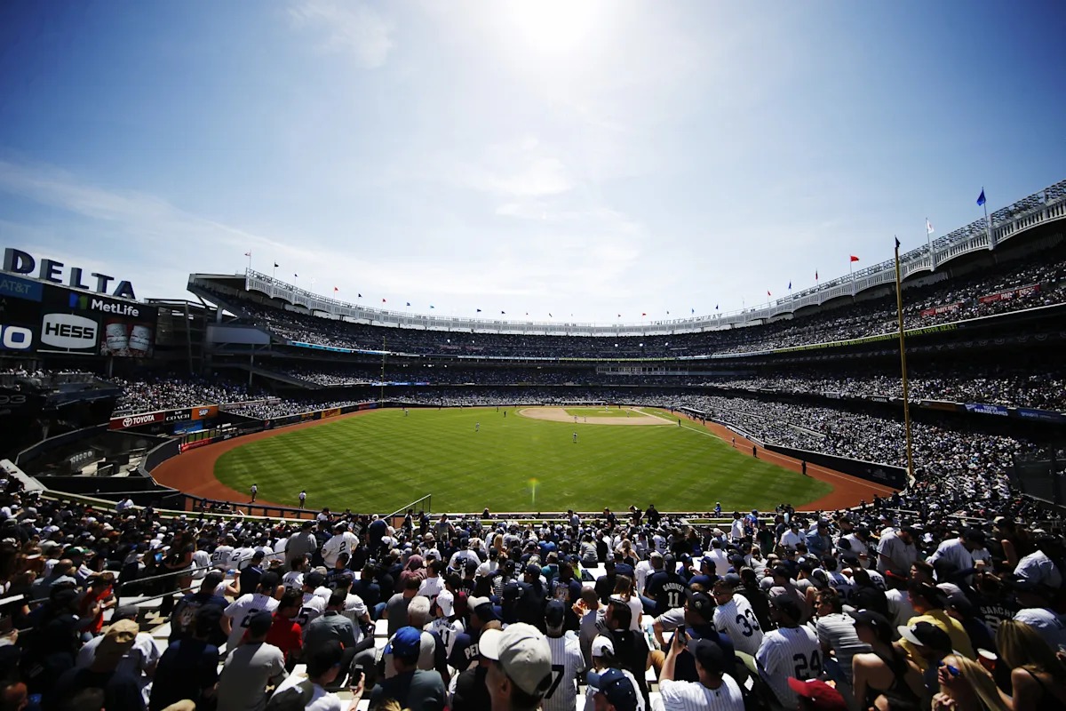Yankee Stadium on a bright day, a full house for October baseball — the Yankees face elimination there Wednesday night
