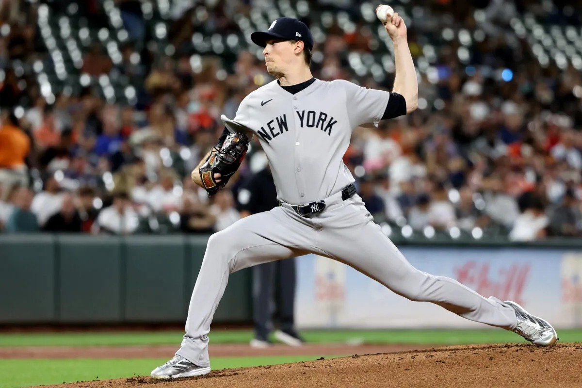 Yankees pitcher Max Fried in his delivery in the gray road uniform