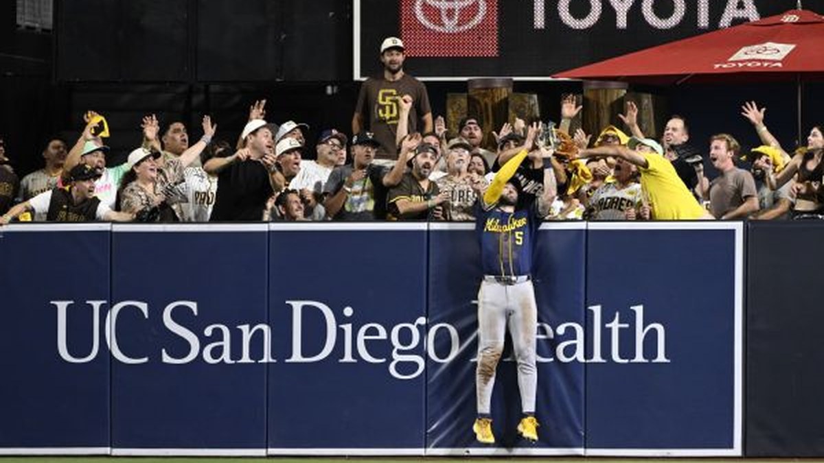 Milwaukee Brewers outfielder Garrett Mitchell leaps at the center-field wall to rob Manny Machado of a game-tying home run during Game 4 of the NLDS at Petco Park