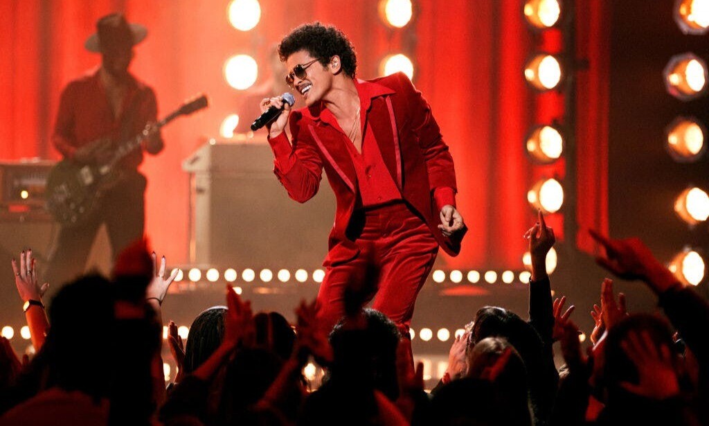Bruno Mars performing on stage — 'I Just Might' has tied the record for most weeks at No. 1 on Billboard's Hot R&B/Hip-Hop Songs chart.
