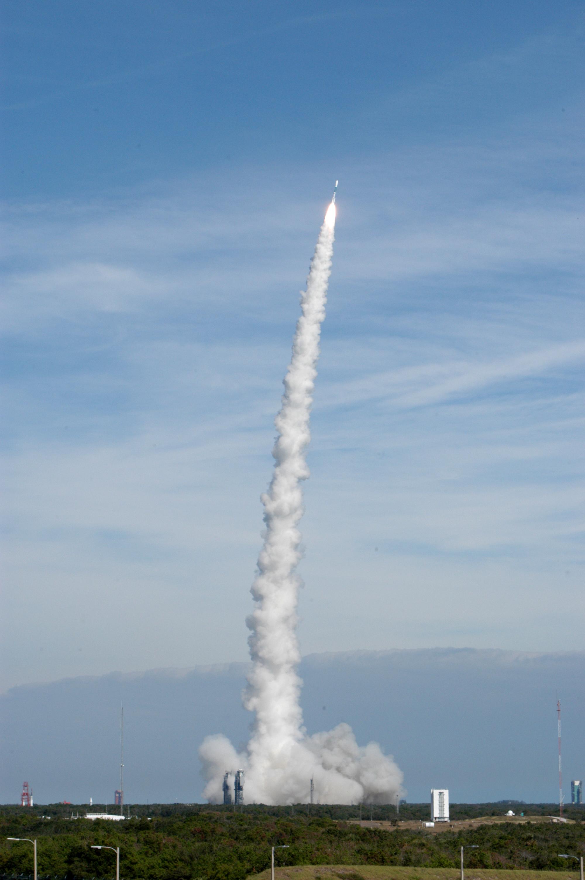 A Delta II rocket carrying NASA's Swift observatory lifts off from Cape Canaveral on November 20, 2004, trailing a long column of smoke