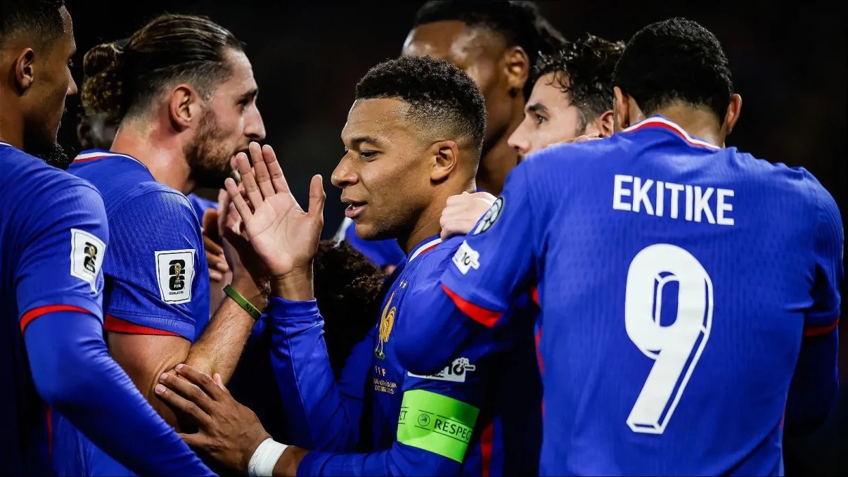 Kylian Mbappe celebrates with France teammates after a goal